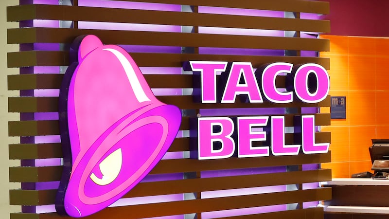 FILE - The Taco Bell logo is seen, April 19, 2019, at a restaurant in Miami. Taco Bell rang up...