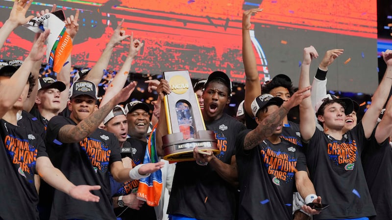 Florida celebrates after beating Houston in the national championship at the Final Four of the...