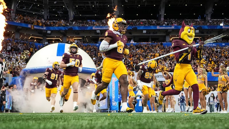 Arizona State players take the field before the first half in the quarterfinals of a College...