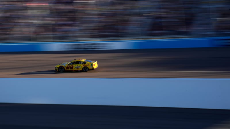 Joey Logano drives during a NASCAR Cup Series Championship auto race at Phoenix Raceway,...