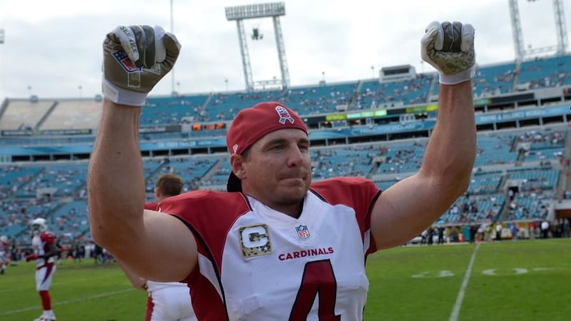 .(AP Photo/Phelan M. Ebenhack) Arizona Cardinals kicker Jay Feely (4) cheers on the sideline...