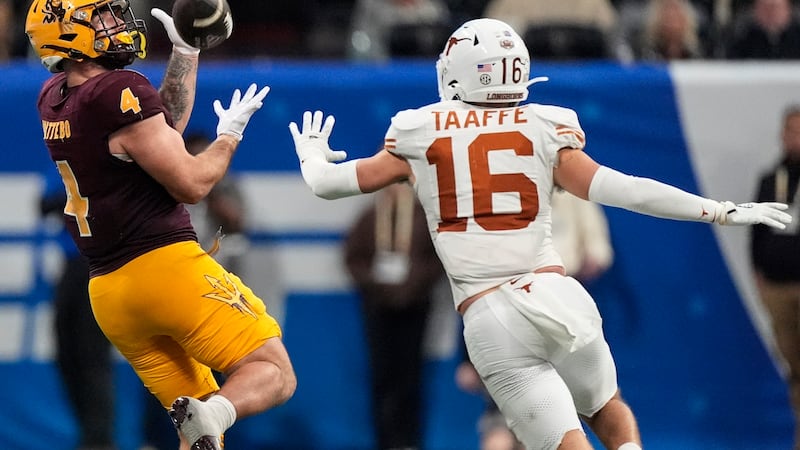 Arizona State running back Cam Skattebo (4) makes the catch against Texas defensive back...