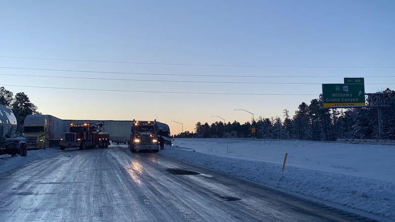 Photos from ADOT showed several semi-trucks jackknifed on the slick road.