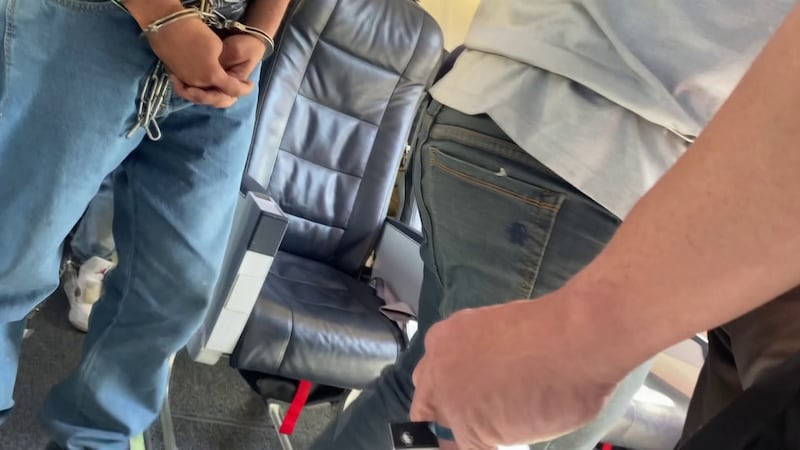A former flight attendant took a video of a charter flight for ICE under the Biden...