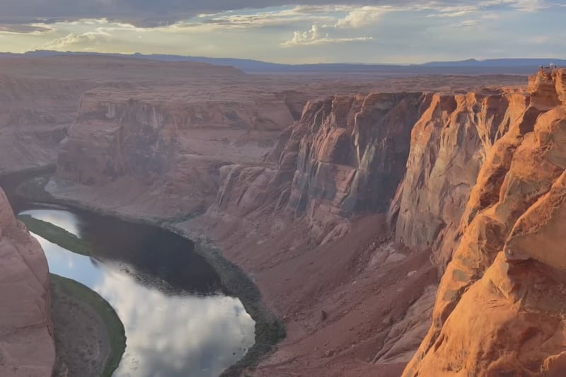 The Colorado River winds through the area, from the Glen Canyon Dam, down toward the Grand...