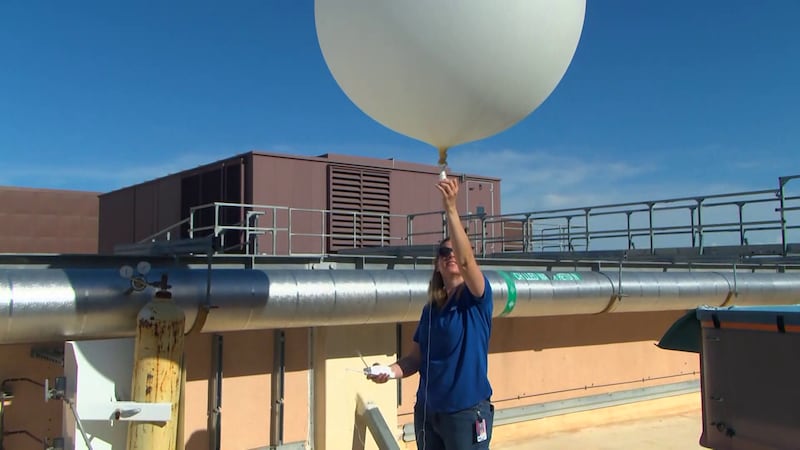 A meteorologist heads up to the roof daily and releases the balloon into the sky. It can reach...
