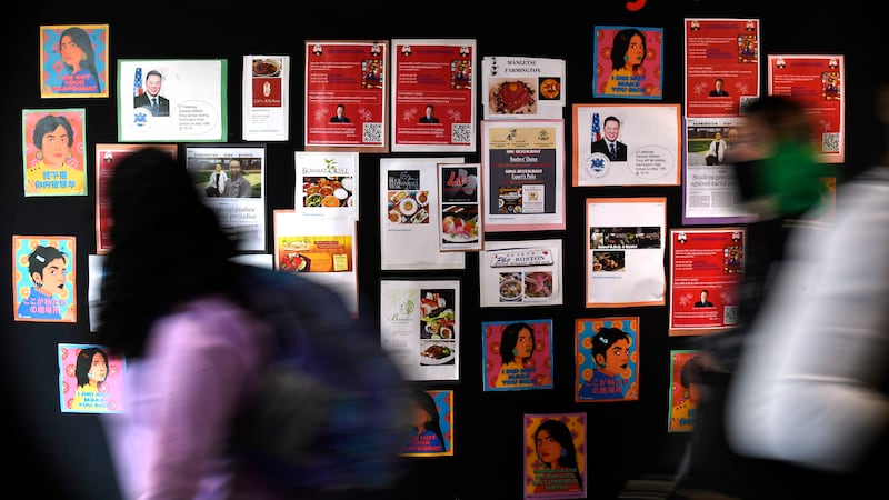 FILE - Students walk past a display for Asian Pacific American Heritage Month at Farmington...