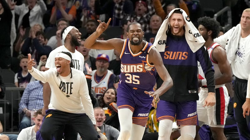 Phoenix Suns forward Kevin Durant (35) celebrates after scoring against the Portland Trail...
