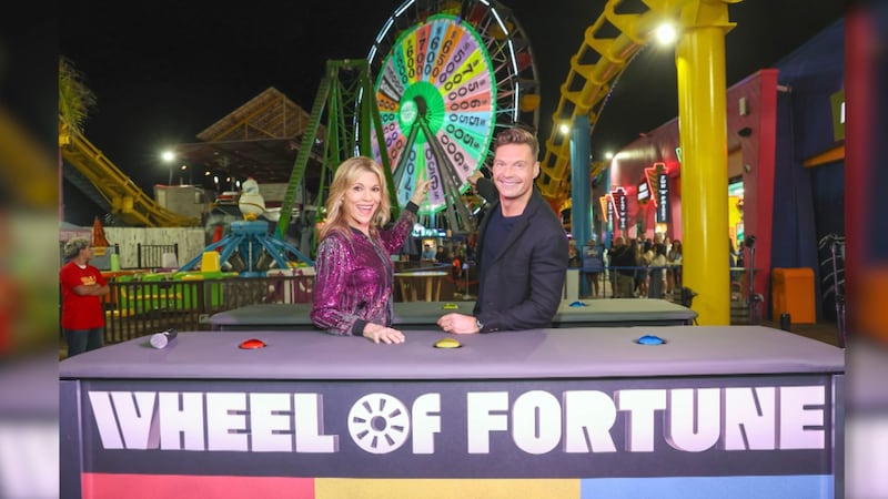 Ryan Seacrest and Vanna White host "Wheel of Fortune."