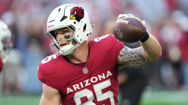 Arizona Cardinals tight end Trey McBride (85) warms up before an NFL football game against the...