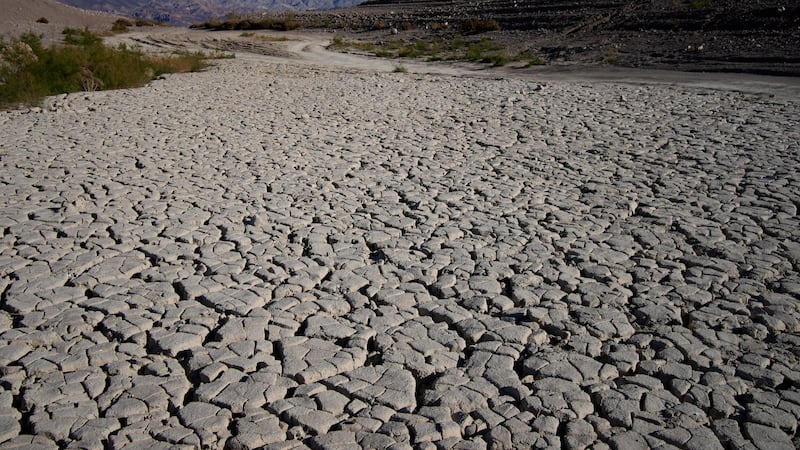 Cracked earth is visible in an area once under the water of Lake Mead at the Lake Mead...