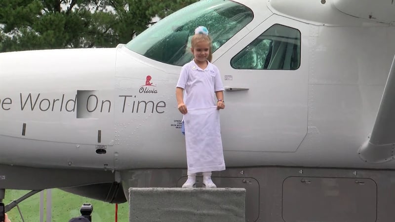 Olivia with her namesake plane
