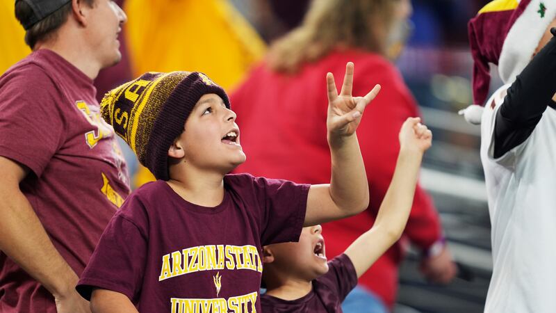 Arizona State fans celebrate after their victory against Iowa State at the Big 12 Conference...
