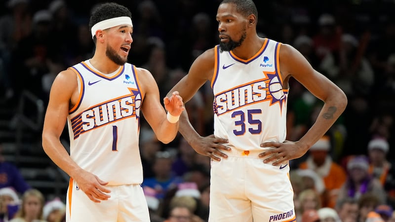 Phoenix Suns guard Devin Booker (1) and forward Kevin Durant (35) during the second half of an...