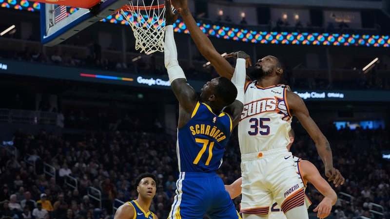 Phoenix Suns forward Kevin Durant (35) blocks a shot by Golden State Warriors guard Dennis...