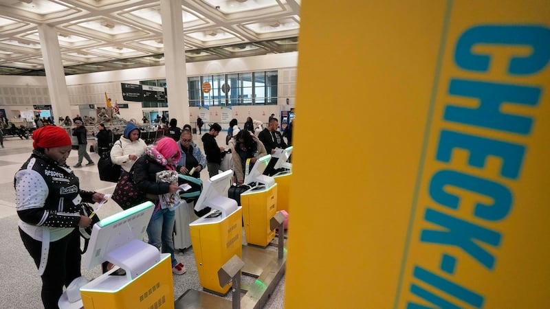 Passengers check-in for their flights at George Bush Intercontinental Airport Monday, Jan. 20,...