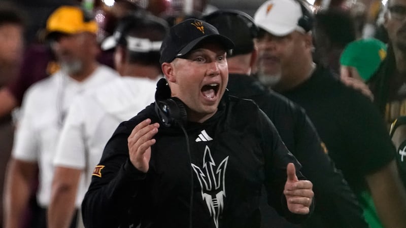Arizona State head coach Kenny Dillingham celebrates a touchdown against Kansas during the...