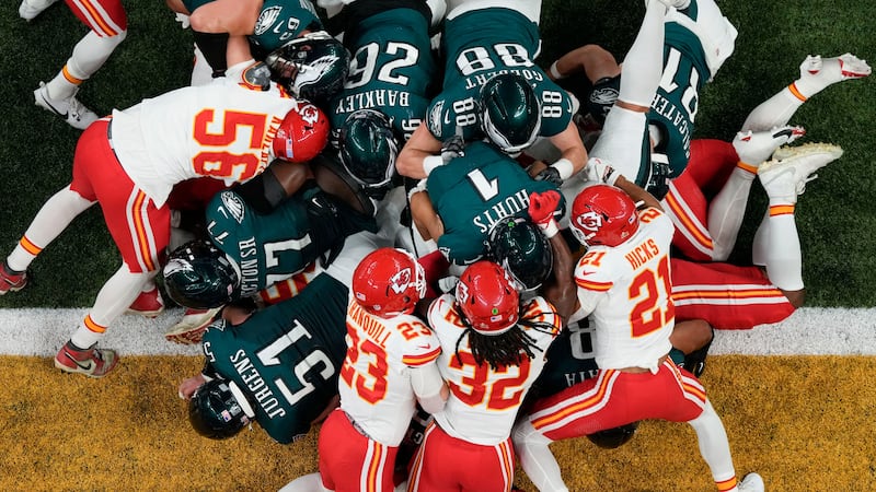 FILE -- Philadelphia Eagles quarterback Jalen Hurts (1) scores a touchdown against the Kansas...