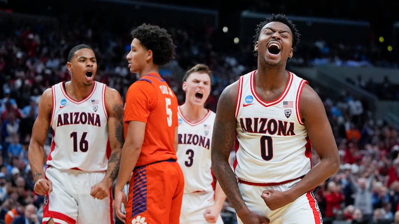 Arizona guard Jaden Bradley (0) celebrates after scoring during the first half of a Sweet 16...