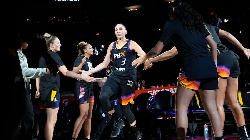 Phoenix Mercury guard Diana Taurasi (3) slaps hands with teammates during player introductions...