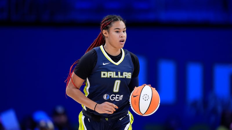 FILE - Dallas Wings forward Satou Sabally handles the ball during a WNBA basketball game...