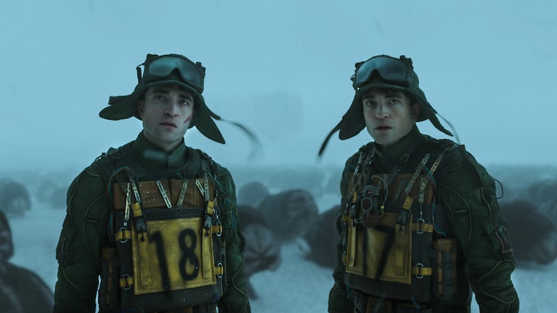 (L to R) ROBERT PATTINSON as Mickey 18 and ROBERT PATTINSON as Mickey 17 in “MICKEY 17,” a...