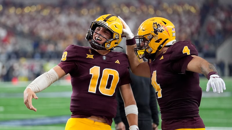 Arizona State quarterback Sam Leavitt (10) and running back Cam Skattebo (4) celebrate a...