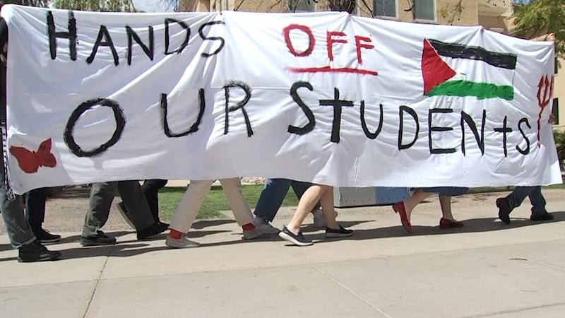 Students protesting Thursday after Arizona State University confirmed that the U.S. Department...