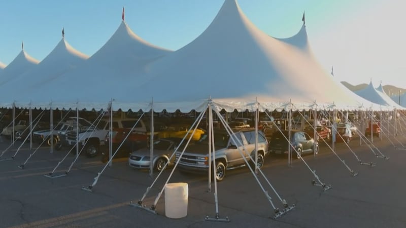 This image shows cars under tents at Barrett-Jackson in Scottsdale.