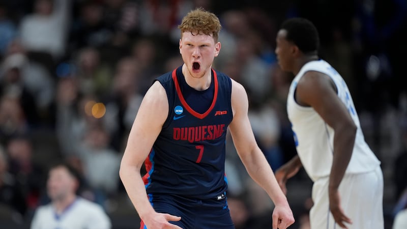 Duquesne forward Jakub Necas (7) celebrates after a three-point basket against BYU in the...