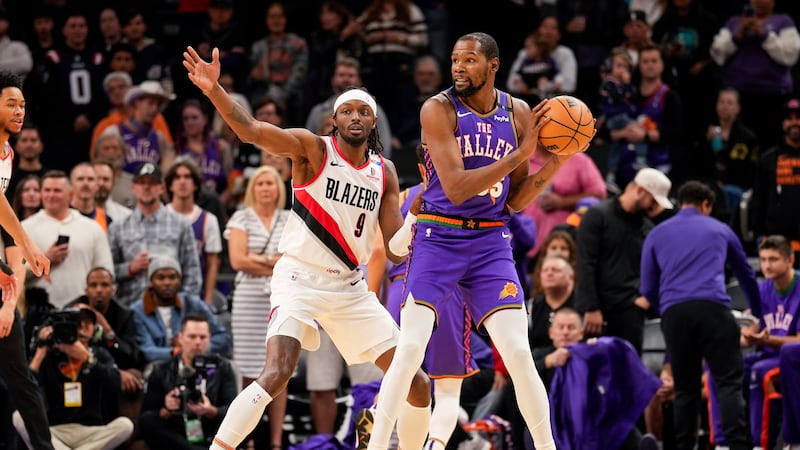Portland Trail Blazers forward Jerami Grant (9) guards Phoenix Suns forward Kevin Durant (35)...