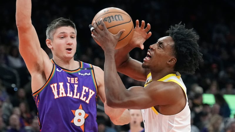 Utah Jazz guard Collin Sexton, right, drives past Phoenix Suns guard Grayson Allen (8) during...