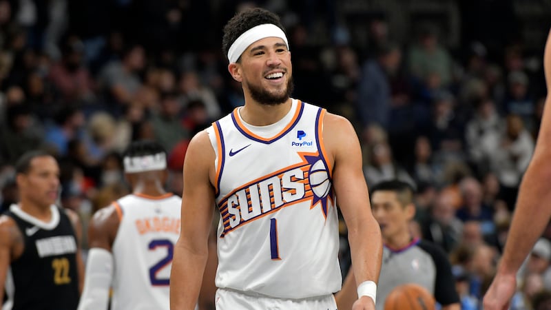 Phoenix Suns guard Devin Booker (1) reacts in the first half of an NBA basketball game against...