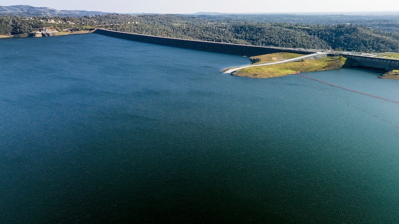 FILE - The Oroville Dam, top right, holds back water at Lake Oroville on March 25, 2023, in...