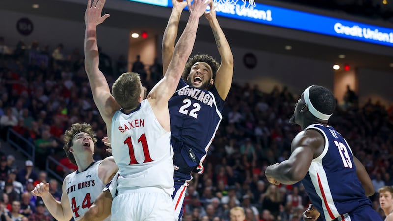 Gonzaga forward Anton Watson (22) shoots over Saint Mary's center Mitchell Saxen (11) during...