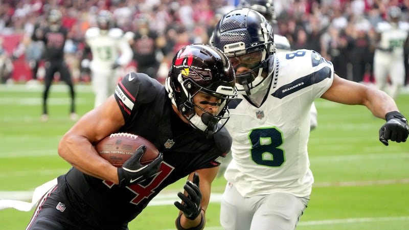Arizona Cardinals wide receiver Michael Wilson scores a touchdown as Seattle Seahawks...