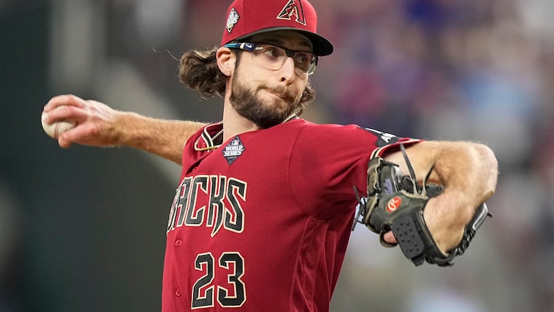 Arizona Diamondbacks starting pitcher Zac Gallen throws against the Texas Rangers during the...