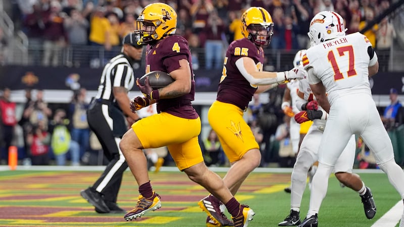 Arizona State running back Cam Skattebo (4) runs the ball for a touchdown against Iowa State...